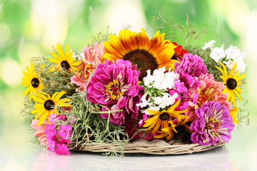 Beautiful bouquet of bright flowers on nature background