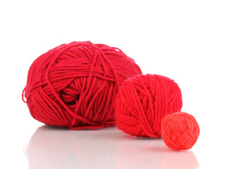 Red knittings yarns isolated on white