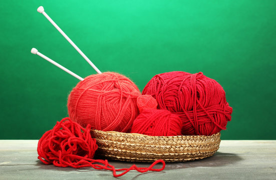 Red knittings yarns in basket