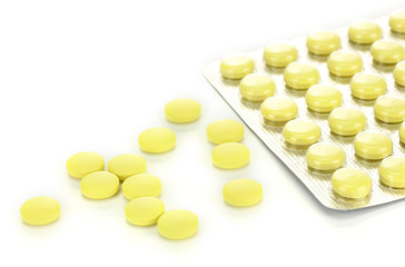 pills packed in blisters, isolated on white