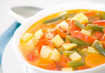 Fresh vegetable soup made of green bean, carrot, potato, red bel