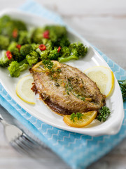 mackerel with steamed broccoli, selective focus