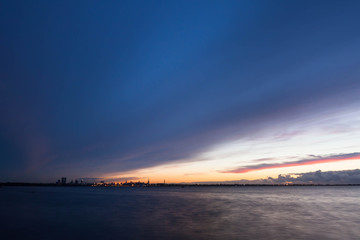 silhouette of tallinn with sea sunset