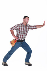 Naklejka premium Construction worker miming.