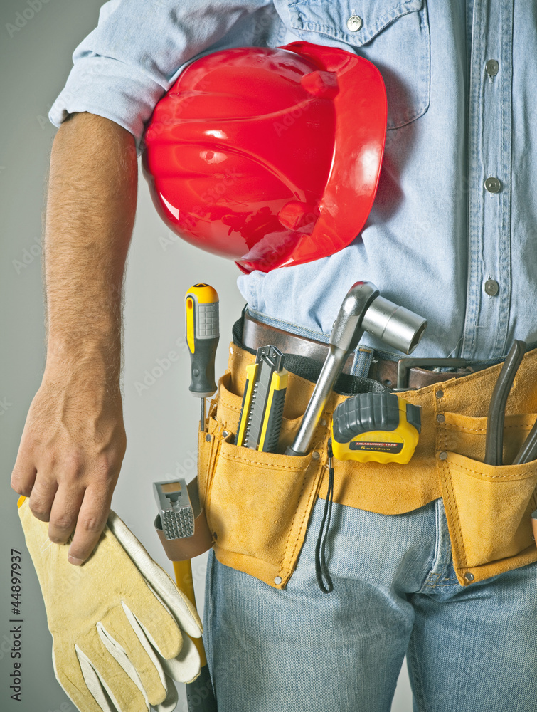 Wall mural worker with tool