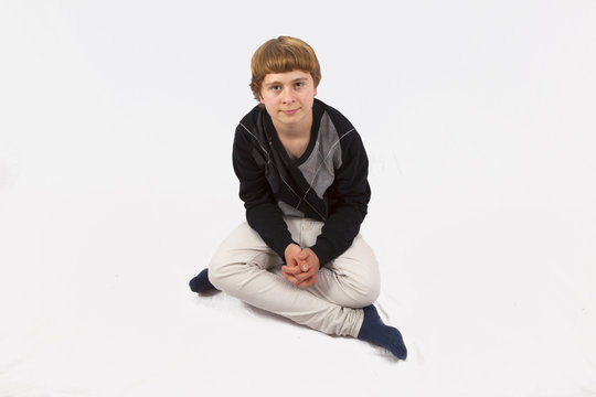 smart happy young boy posing in studio