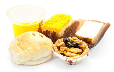 bakery dessert  with orange juice on white background