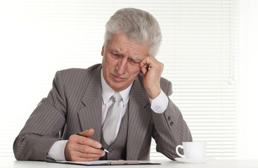 sad old man sitting