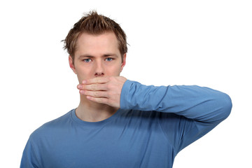 Obraz premium Man with hand on mouth