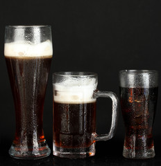 refreshments - beer, cola and kvass isolated on black