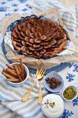 Fresh plum cake with cinnamon and pistachio
