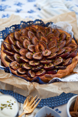 Fresh plum cake with cinnamon and pistachio