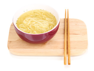asian noodles in bowl on wooden board isolated on white