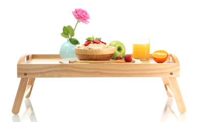 light breakfast on wooden tray isolated on white