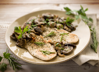 chicken fillet with sauteed mushroom, selective focus