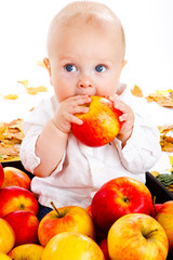 Fototapeta na wymiar Baby eating apple