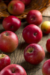 Fototapeta na wymiar Ripe apples on a rustic kitchen table
