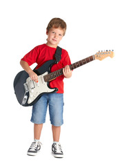 Obraz premium Young boy with electric guitar isolated on white background