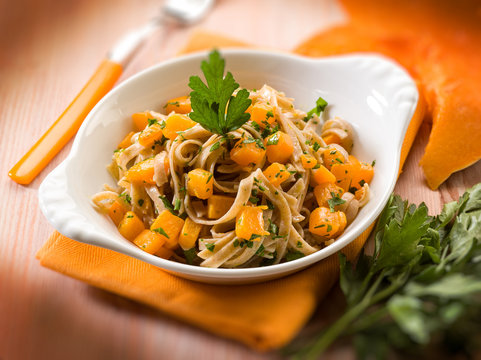 tagliatelle with pumpkins and parsley, selective focus