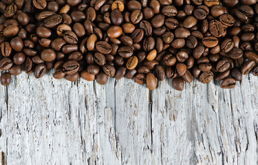 Coffee beans on the old wood