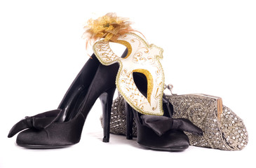 masquerade mask with high heel shoes and handbag