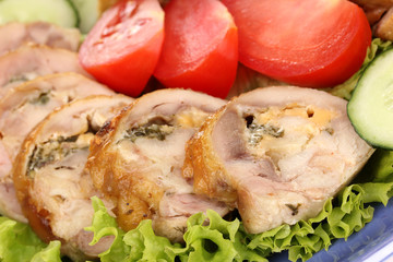 Tasty meat cutlet with garnish on plate close-up