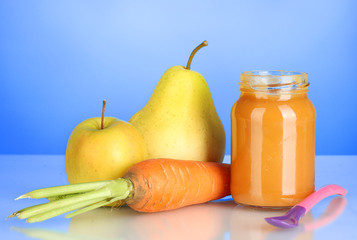 Jar with fruit and vegetables baby food and spoon