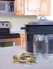 Canning jars and supplies in a kitchen