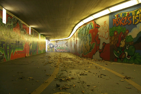 dirty pedestrian underpass with graffitis