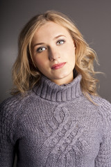 Attractive female student in a sweater