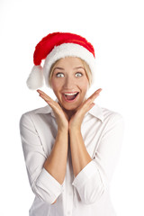 Rapturous young woman in santa hat over white background