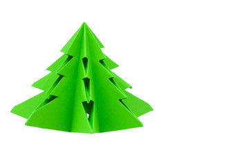 Obraz premium Origami Christmas tree hand made of green paper in kindergarten.