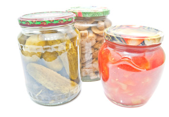 three jars with marinated vegetables