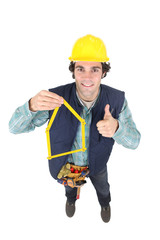 Construction worker with his folding ruler