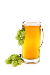 Glass with beer and hop cones.