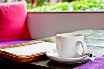 coffee mug with menu in the restaurant