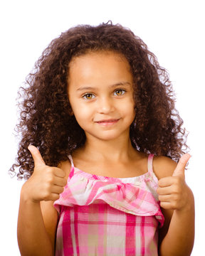 Mixed race child giving thumbs up