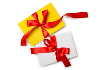 Envelope with colourful ribbon on white