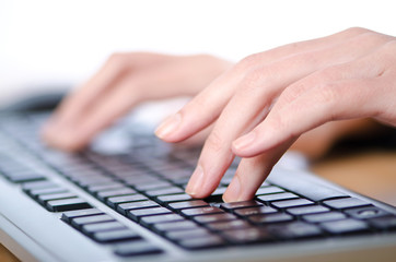 Hands typing on the keyboard