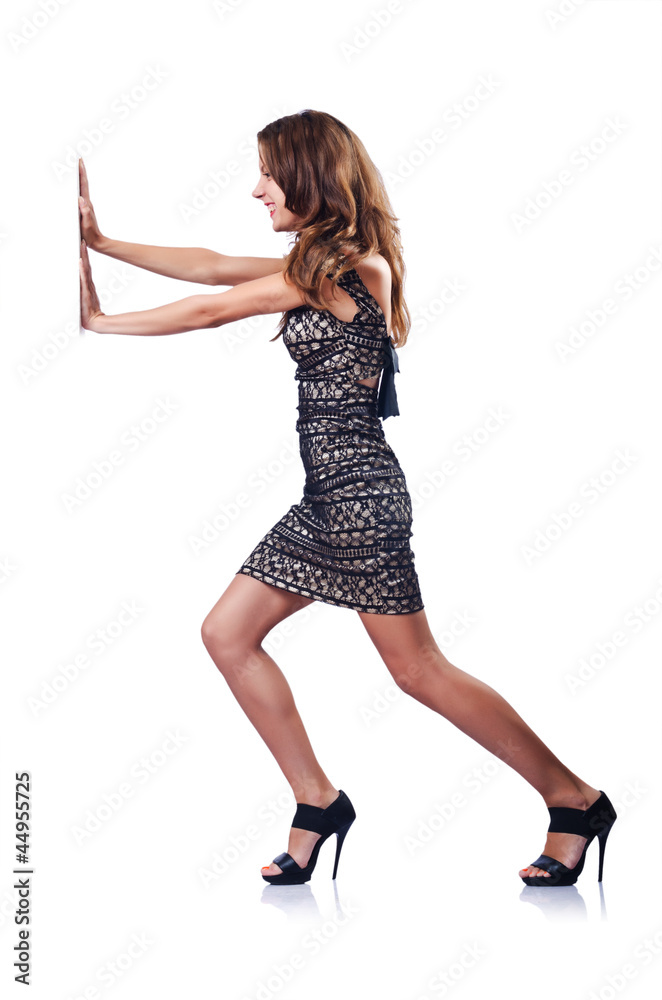 Wall mural young attractive woman pushing virtual obstacles