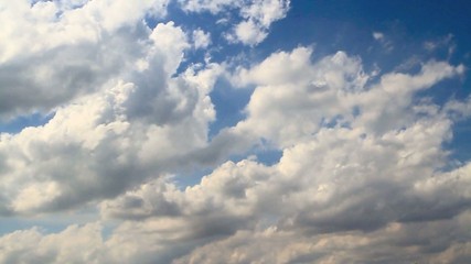 Accelerated blue fluffy cloudscape
