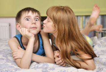 girl kissing boy on cheek