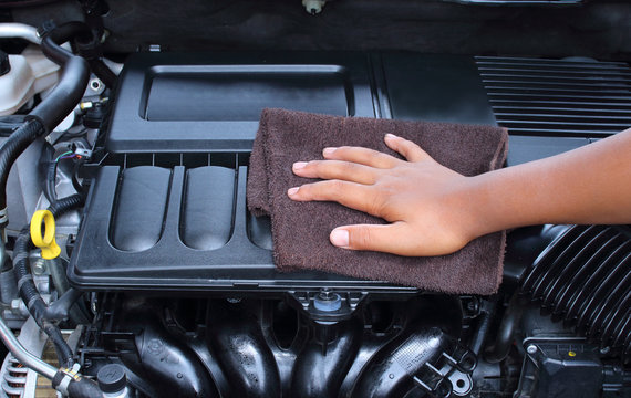 man man wiping car engine for new vehicle