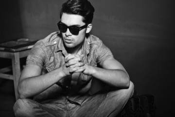 Vintage stylized black and white photo of young male model