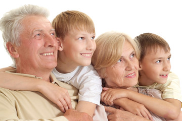 Granddad and granny  with their nice grandchildren