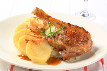 Roast duck with potato dumplings and white cabbage