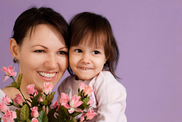 Caucasian female with a daughter and flowers