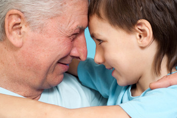 Caucasian pensioner male with a boy