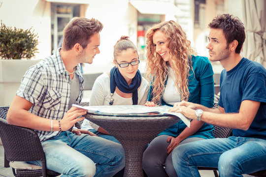 Group of Tourists Looking at Map