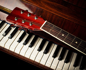 Naklejka premium guitar neck on old piano keys